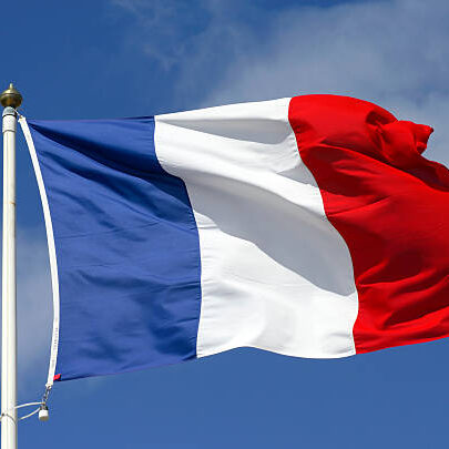 French flag blowing in the wind.